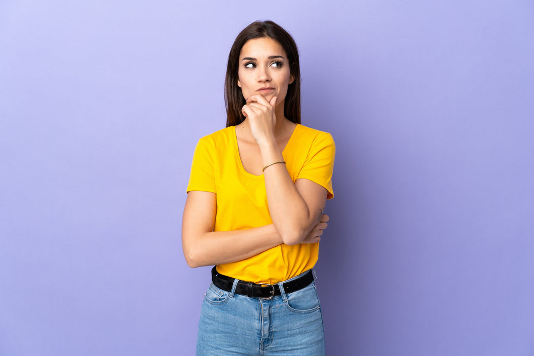 Woman holding chin as if to ask a question